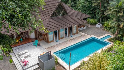 an aerial view of a house with a swimming pool at Casa Ambar in Puerto Viejo