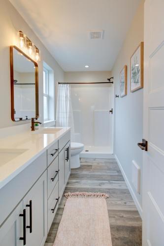 a bathroom with a sink and a toilet and a mirror at The Ginger Pearl in Ocean Shores