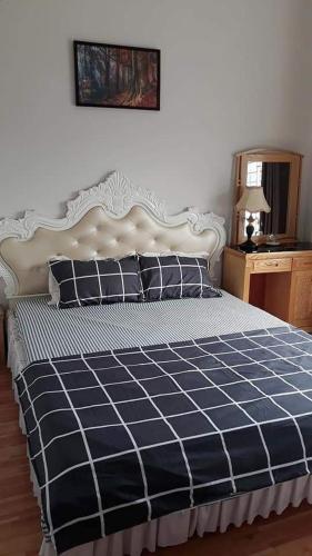 En eller flere senge i et værelse på Nhà nghỉ Lucky Motel