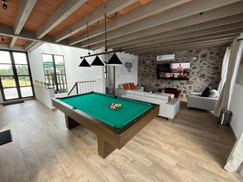 a living room with a pool table in it at Casa Frida con Piscina Privada Caliente, Aire Acondicionado, Billar, Parrilla & FirePit in San Miguel de Allende