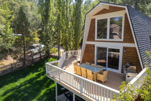 an aerial view of a tiny house with a deck at Scout's Lakehouse Retreat by Colby & Conrad in Lake Arrowhead
