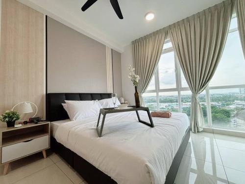 a bedroom with a large bed with a table on it at Ksl C2 3R3B 1-5pax #Daya#Austin#Ikea#Aeon in Johor Bahru