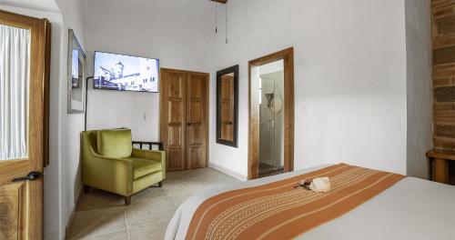Postel nebo postele na pokoji v ubytování Hotel Casona El Calvario