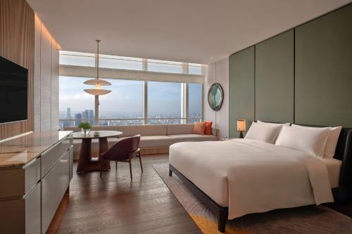 Postel nebo postele na pokoji v ubytování Park Hyatt Changsha