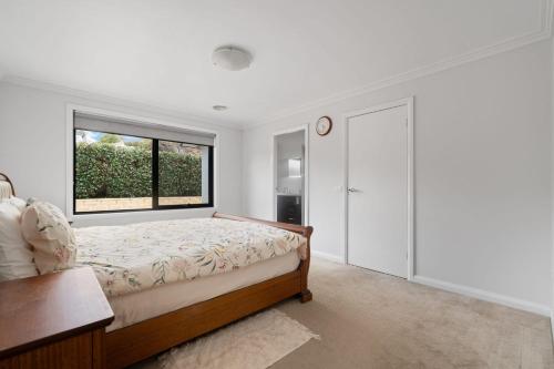 Ένα ή περισσότερα κρεβάτια σε δωμάτιο στο O'Reilly Residence - Spacious & Cosy 4 Bedroom Home