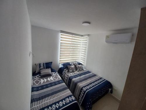 Postel nebo postele na pokoji v ubytování Apartamento en Ricaurte para descansar y disfrutar