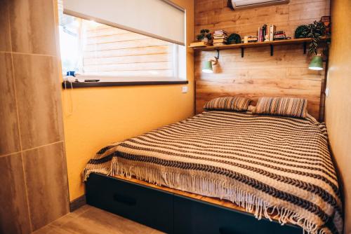 a bedroom with a bed in a room at Eco House Uman in Umanʼ