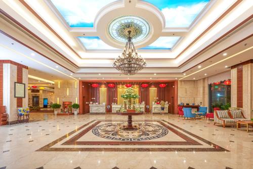 a large lobby with a chandelier in the middle at DLG Hotel Danang in Da Nang