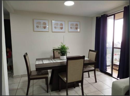 a dining room with a table and chairs at Alojamiento entero in Mexico City