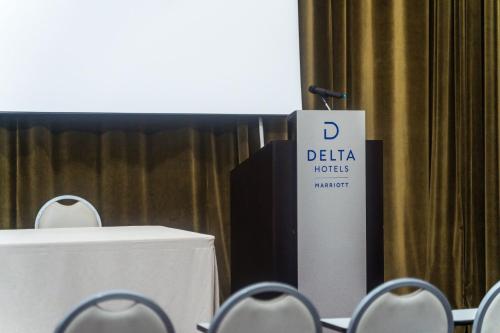 a podium with a sign that says delta nodes market at Delta Hotels by Marriott Olbia Sardinia in Olbia