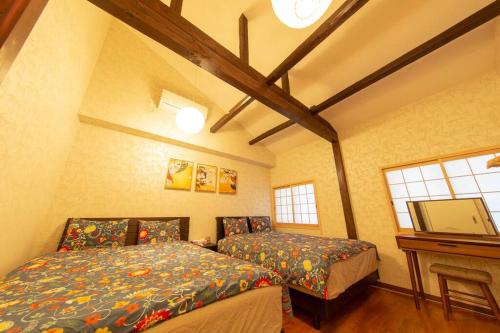 Postel nebo postele na pokoji v ubytování Luxury Modern Japanese style house