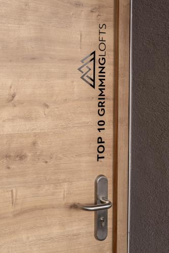 Un certificado, premio, letrero u otro documento en GRIMMINGlofts