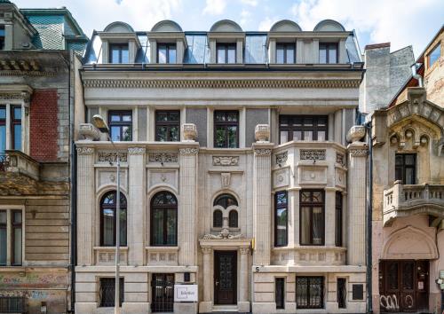an old building in the middle of a city at Ecletico Villa in Bucharest