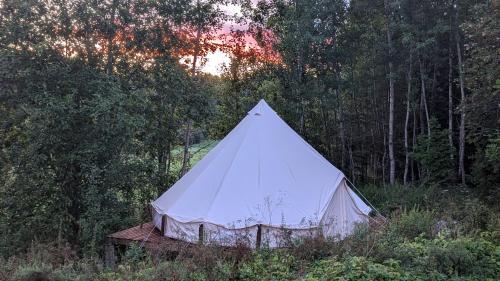 a white tent sitting in the middle of a field at Bell-tent Noord in Lappeenranta