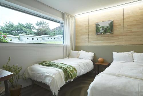 Llit o llits en una habitació de Leejae 리재