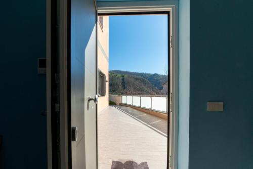 an open door with a view of a balcony at La Stella dei venti in Vico Equense