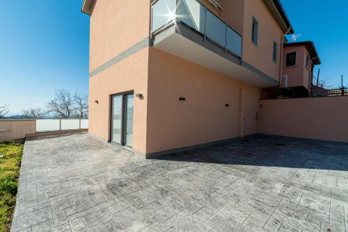 a house with a large driveway in front of it at La Stella dei venti in Vico Equense