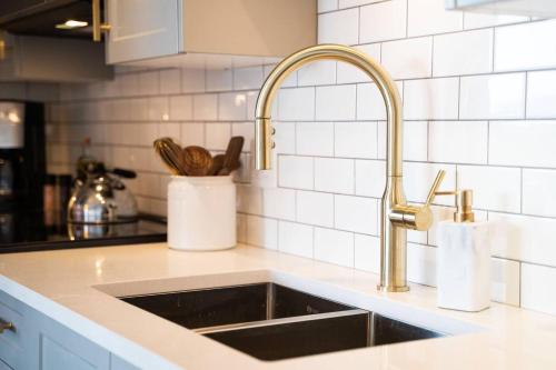 a kitchen counter with a sink in a kitchen at Waterfront Stay With Balcony And Bbq in Victoria