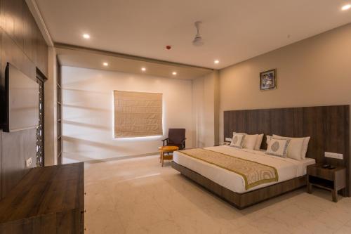 a bedroom with a large bed in a room at Stamps by Eight Continents, Jodhpur in Jodhpur