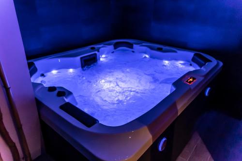 a blue bath tub filled with water in a room at Frasteva Resort in Valverde