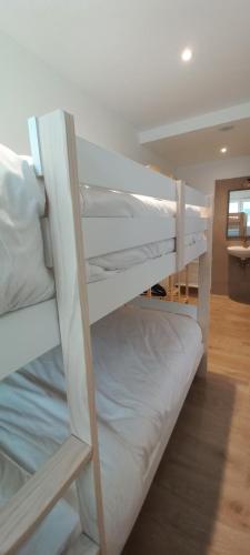 a couple of bunk beds in a room at La familia Apartaments Mijas Pueblo in Mijas