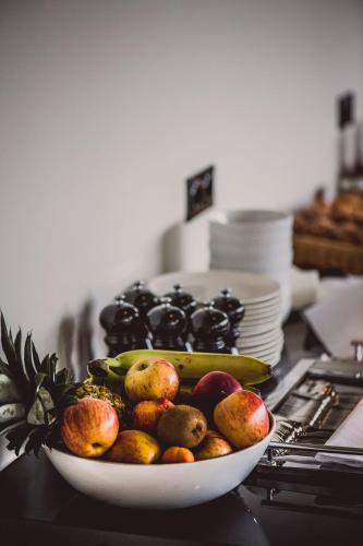 a bowl of fruit on top of a counter at Hotel Bussi Baby in Bad Wiessee