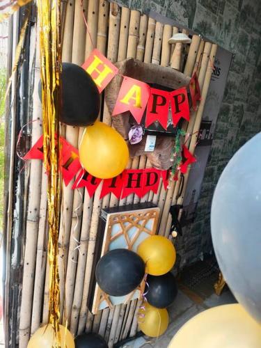 a bunch of decorations on top of a wooden stand at 3BHK floor in urban homestay-swiming pool, Jacuzzi in Zirakpur