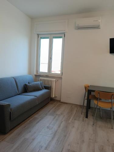 a living room with a couch and a table at Attico 28 in Lecce