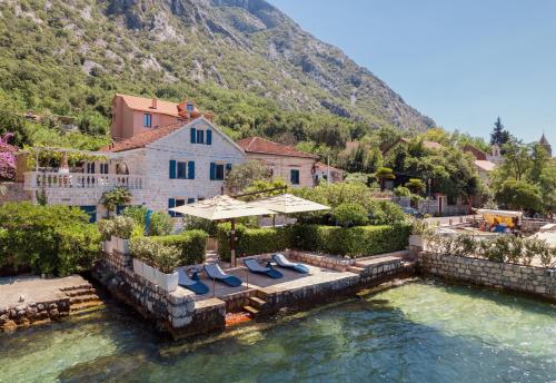 an aerial view of a house on a river at Villa Blue Dream in Dobrota
