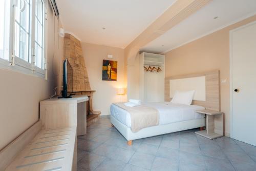 Postel nebo postele na pokoji v ubytování Planos Beach Hotel