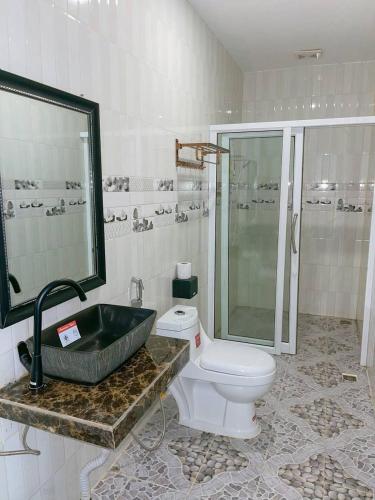 a bathroom with a sink and a toilet and a shower at V-Relaxing Resort in Kampot