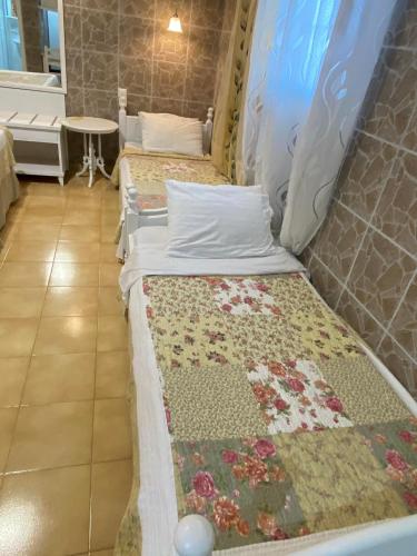 a couple of beds sitting in a room at RESIDENTS IONIAN (BED AND BREAKFAST) in Argostoli