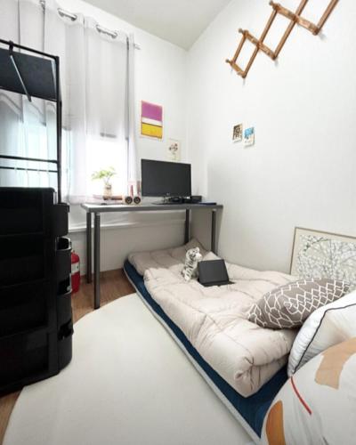 a living room with a couch and a desk at 프라이빗공간 in Gwangju