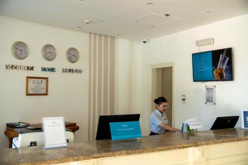 a man sitting at a desk in a waiting room at Sierra Sharm El Sheikh in Sharm El Sheikh