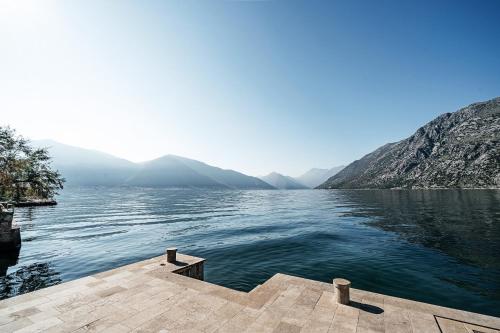 a view of a body of water with mountains at Villa Shah Complex in Kotor