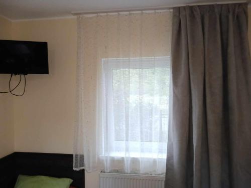 TV a/nebo společenská místnost v ubytování Pokoje Przy Alei Trzebież