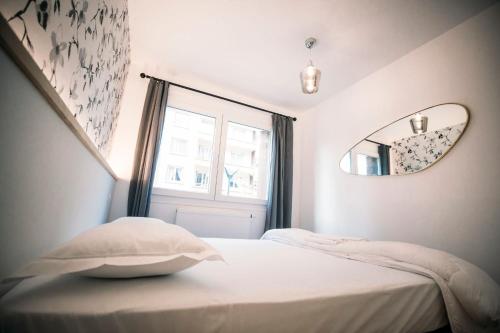 En eller flere senge i et værelse på Le Majestic - T2 en centre ville