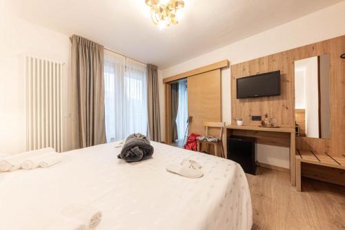Postel nebo postele na pokoji v ubytování Hotel La Perla