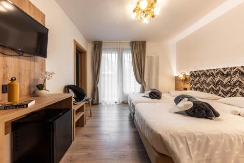 Postel nebo postele na pokoji v ubytování Hotel La Perla