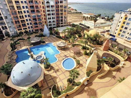 an aerial view of a resort with a swimming pool at Playa Honda vistas al mar, 1a Línea playa, PARKING, WIFI in Playa Honda