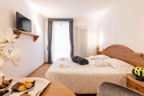 Postel nebo postele na pokoji v ubytování Hotel La Perla