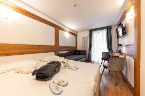 Postel nebo postele na pokoji v ubytování Hotel La Perla
