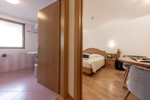 Postel nebo postele na pokoji v ubytování Hotel La Perla