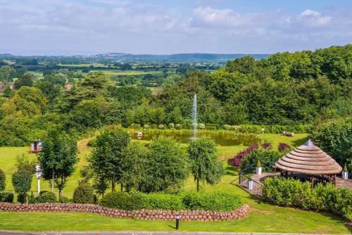 an aerial view of a garden with a gazebo at DoubleTree by Hilton Bristol South - Cadbury House in Yatton