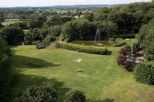 an aerial view of a park with a fountain at DoubleTree by Hilton Bristol South - Cadbury House in Yatton