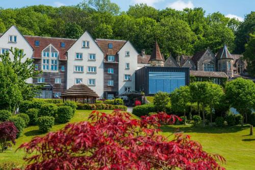a large house with a garden in front of it at DoubleTree by Hilton Bristol South - Cadbury House in Yatton