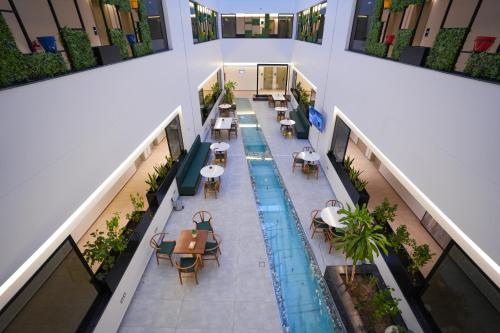 an overhead view of the lobby of a building with a swimming pool at Snood Al Narjis Hotel in Riyadh