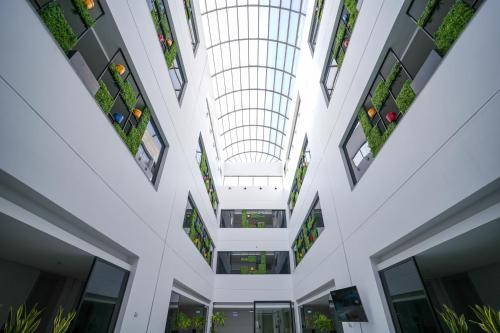 an internal view of a building with plants at Snood Al Narjis Hotel in Riyadh