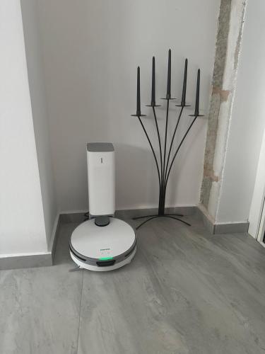 a white appliance sitting on the floor in a room at Villa Erwin with heated pool in Imotski