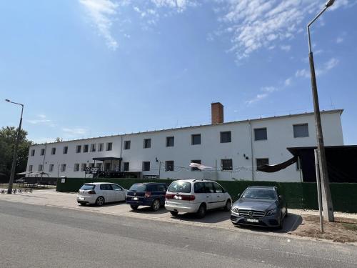 a group of cars parked in front of a building at Dream Home in Szentes